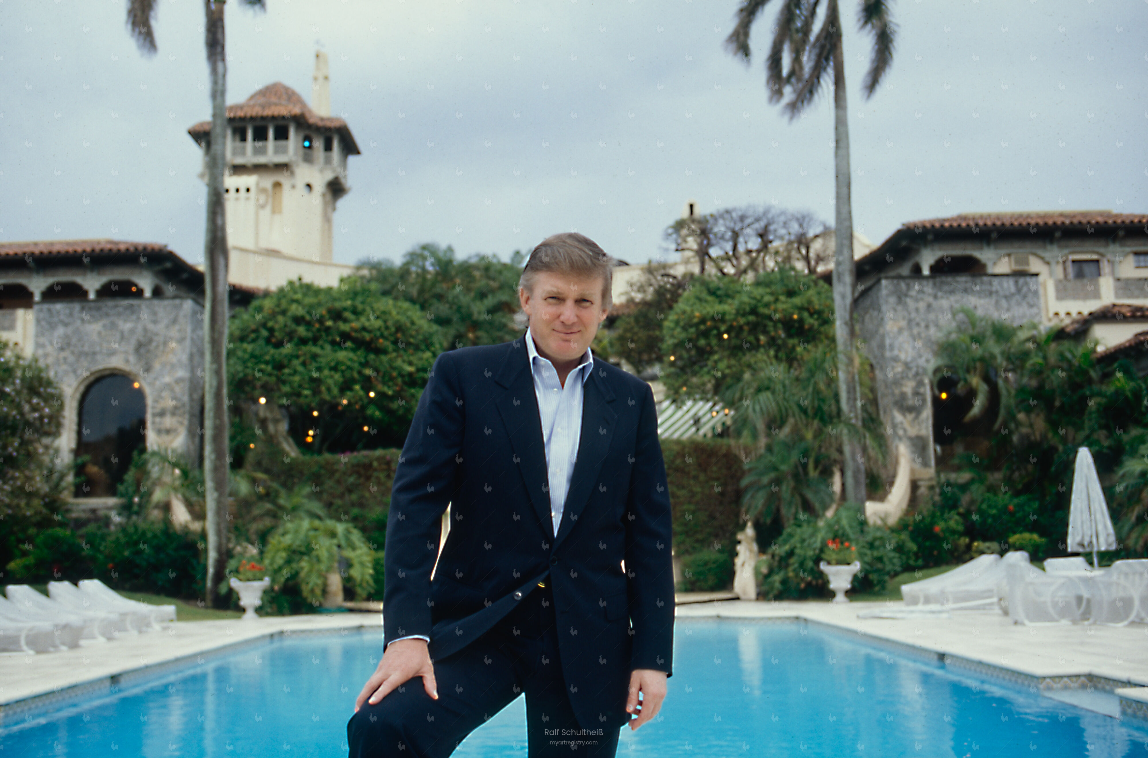 Trump standing by the swimming pool in the garden of Mar-a-Lago 2