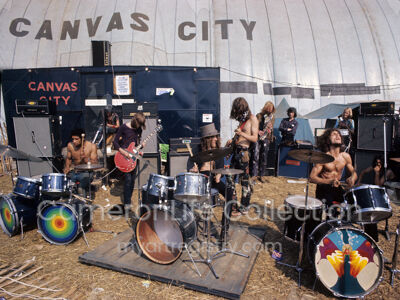 Hawkwind and The Pink Fairies outside Canvas City - Isle of Wight 1970, by Ch...